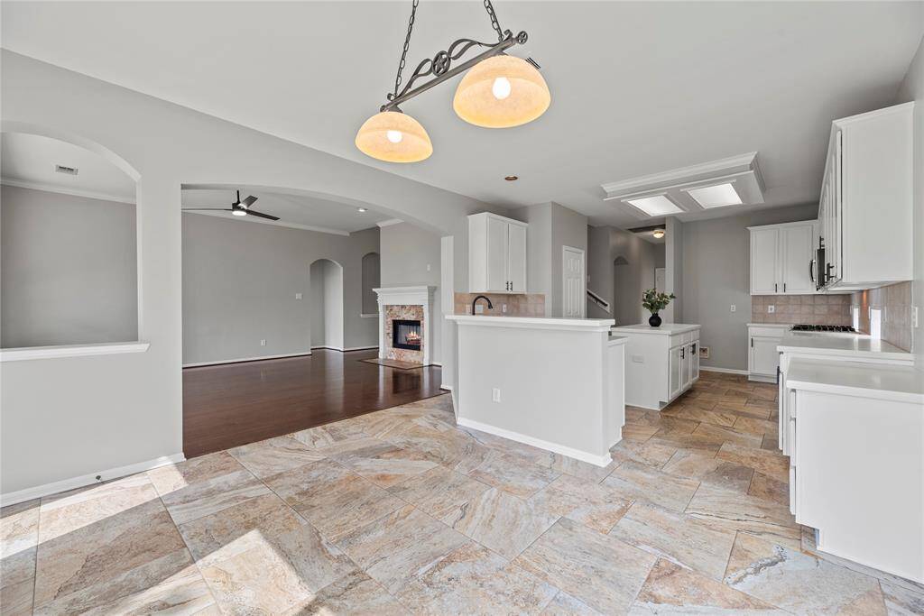 While chopping carrots and slicing cucumbers in the gourmet kitchen, easily converse with those in the breakfast area, as well as those in the living room!
