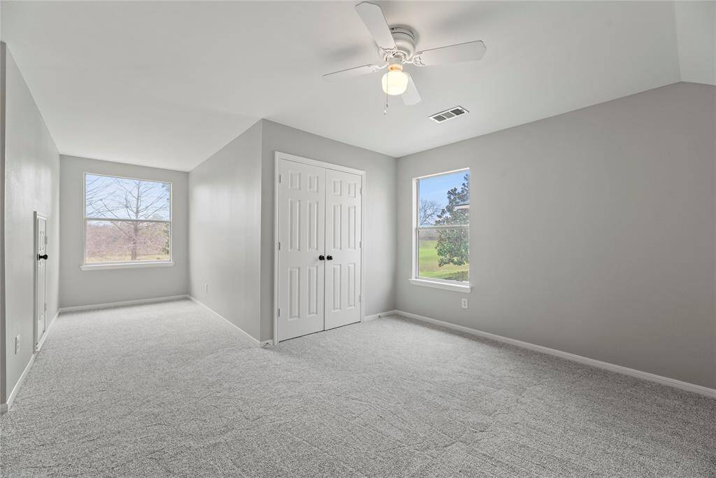 Plush brand new premium carpet and tons of natural light enhance the charm of the bedroom. Whether used for guests or children, the space is highly functional and warmly welcoming.