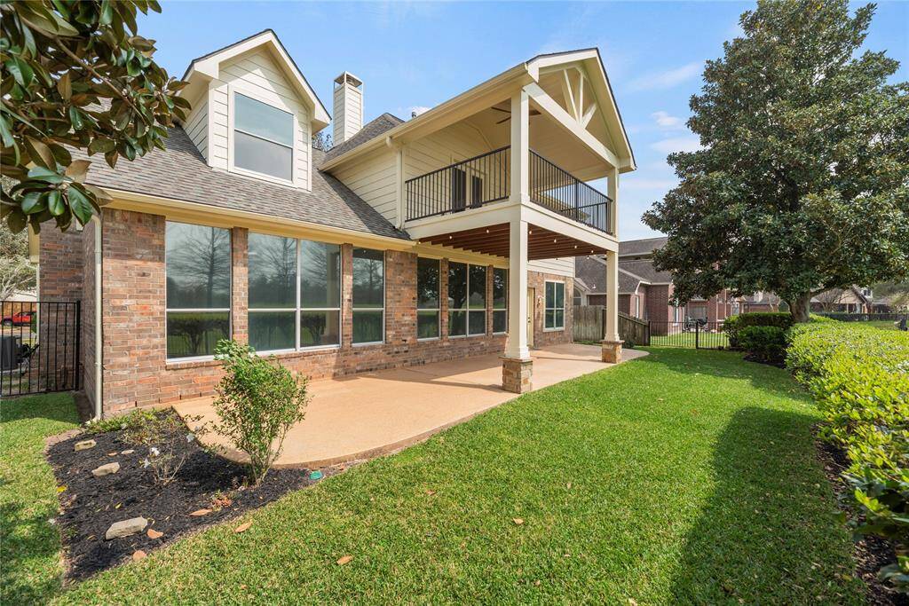The wide patio has tons of space for al fresco dining. Chat with friends over cocktails, as the kiddos and dogs play in the fully fenced-in backyard.