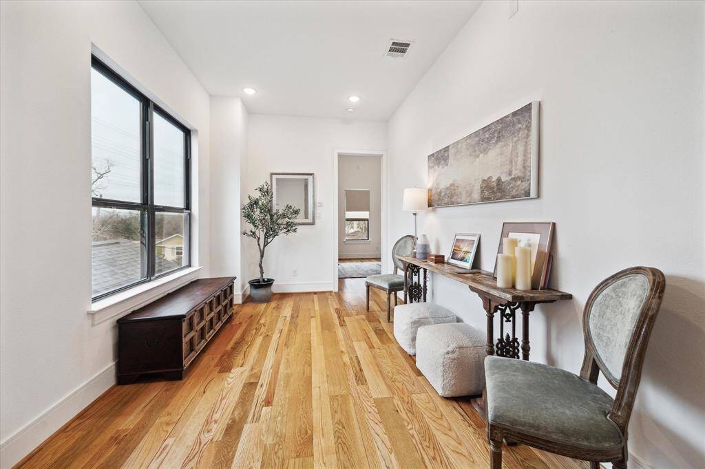 Second floor landing/extra room perfect for a sitting area, open office and more.