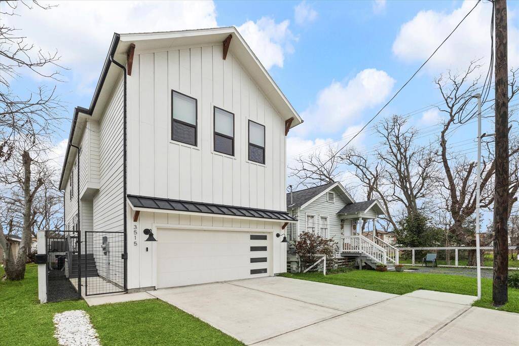 Modern farmhouse style home with batten board siding and metal roof accents. Gated entry, two car garage, gull size driveway located at the dead end of the street.