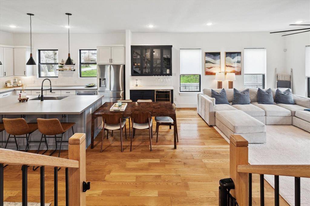 Open floorplan! View from the stairs overlooking part of the kitchen, dining area and living area.