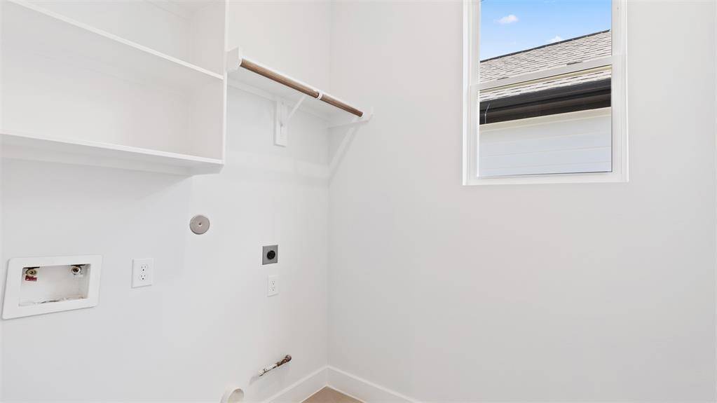 The laundry room features washer and dryer connections, andplenty of storage space.