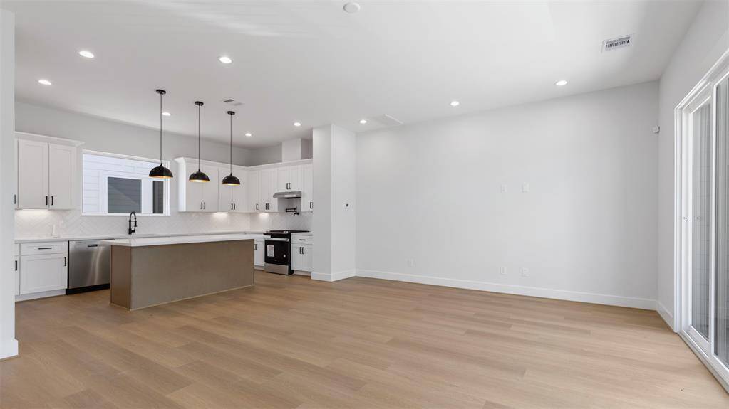 Another view of the bright andspacious living room.