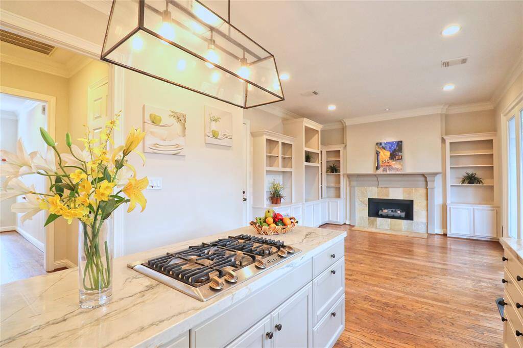 Elegant gas cooktop with five burners  and a new downdraft vent.