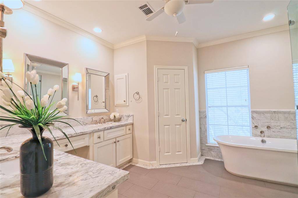 primary bathroom updated with free standing soaking tub.