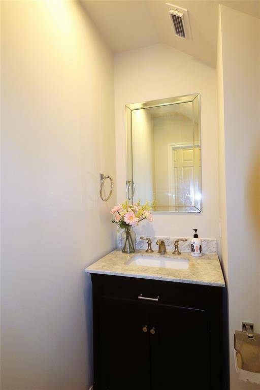 Elegant powder room with modern tile and sleek new vanity.