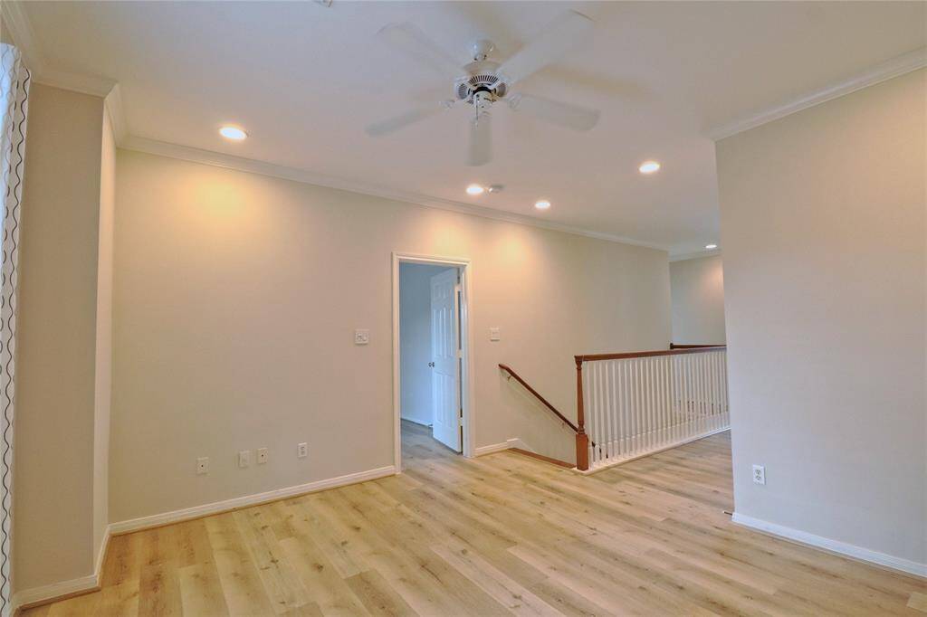 Upstairs game room featuring sleek new laminate flooring.