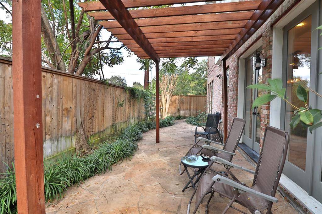 Charming fenced backyard, perfect for relaxation and leisure.