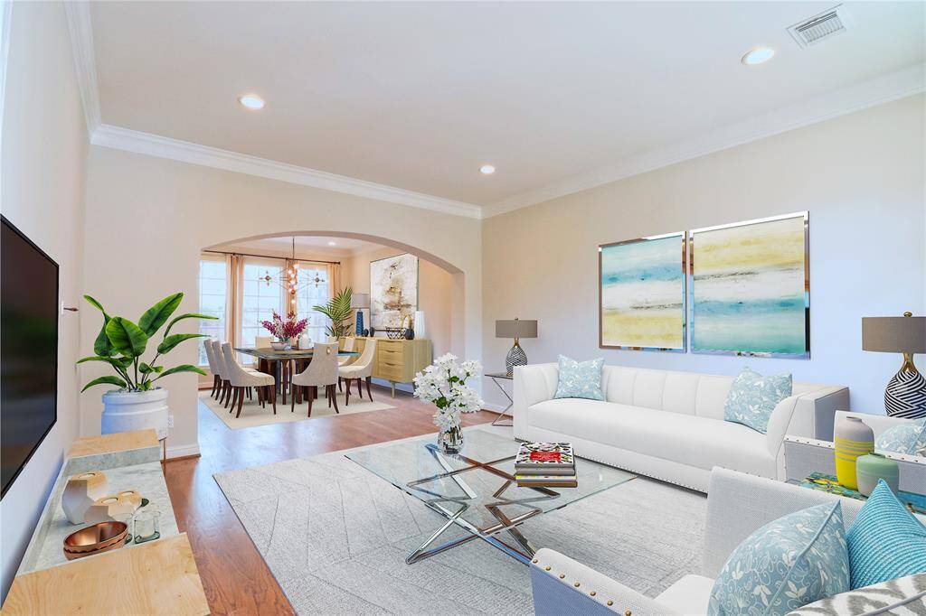 Open floor plan and high windows with tons of natural light , Crown moldings through out the whole house.