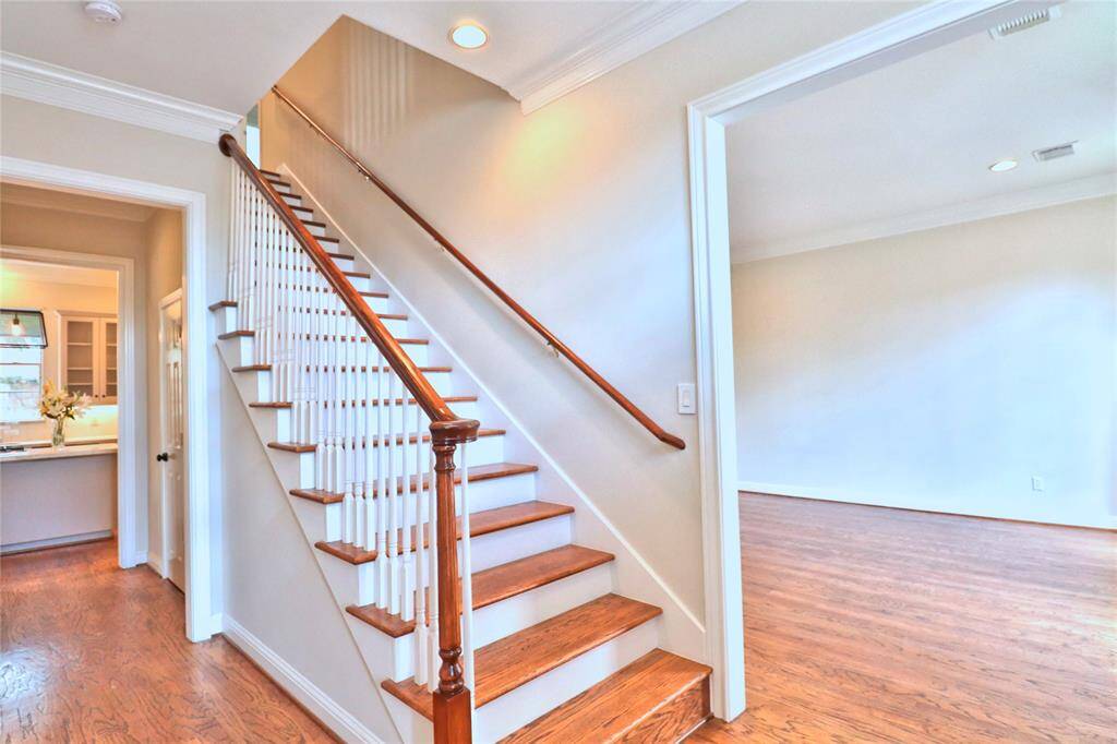 Elegant hardwood flooring graces the entire first floor and staircase.