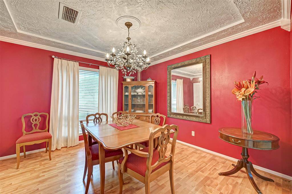 Beautiful formal dining room with sparkling chandelier.