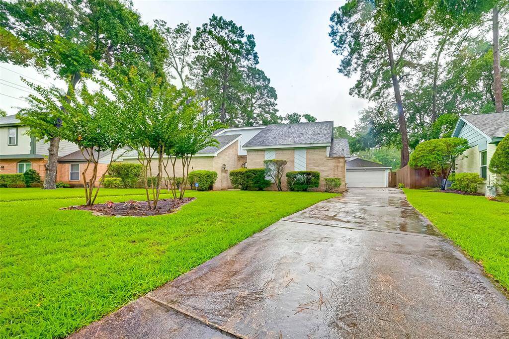Long private driveway leads to a 2 car detached garage.
