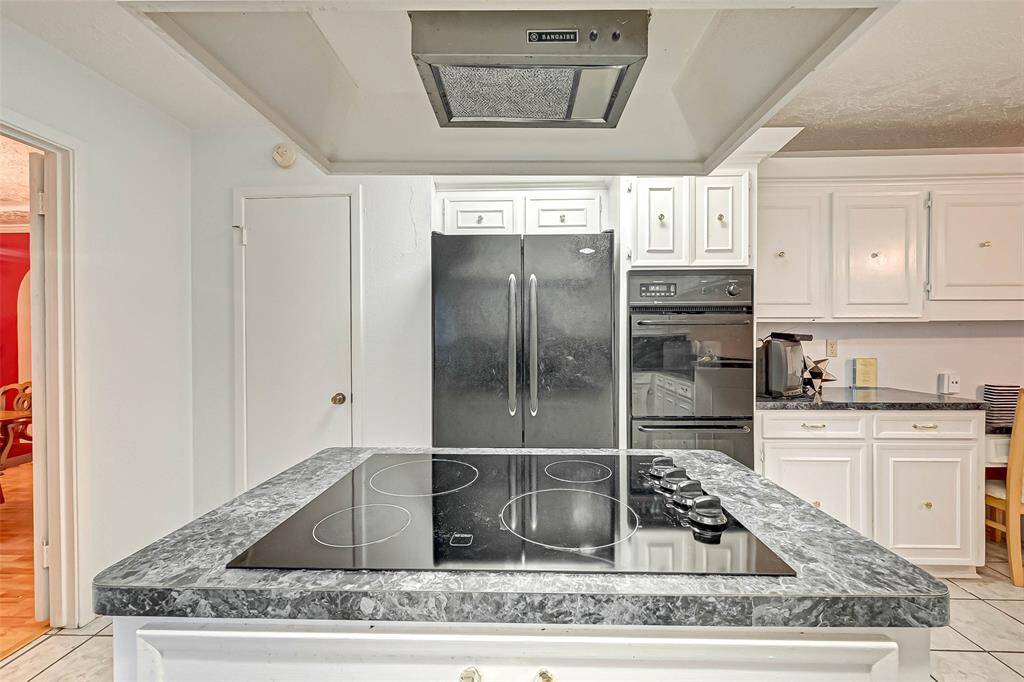 Double ovens and side by side refrigerator is included.