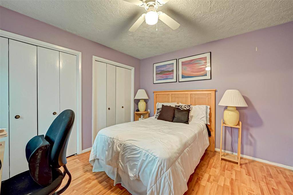 Wall to wall closet space in secondary bedroom.