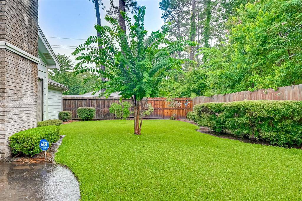 Nice sized back yard with recently replaced wood fencing.