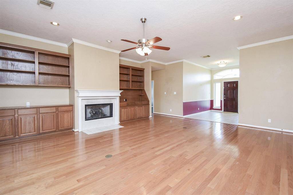 A warm and welcoming family room with abundant natural light and a cozy ambiance, ideal for relaxation and gatherings