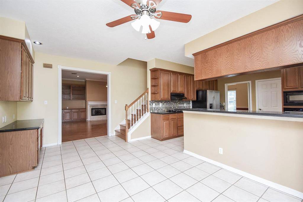 A spacious and thoughtfully designed kitchen with ample counter space, perfect for meal preparation and entertaining