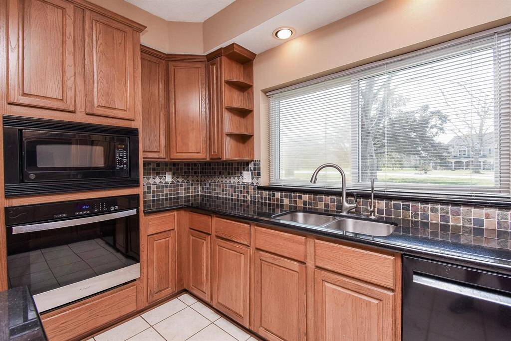 A dedicated cooking area with built-in appliances and a sleek design, making meal preparation a pleasure.