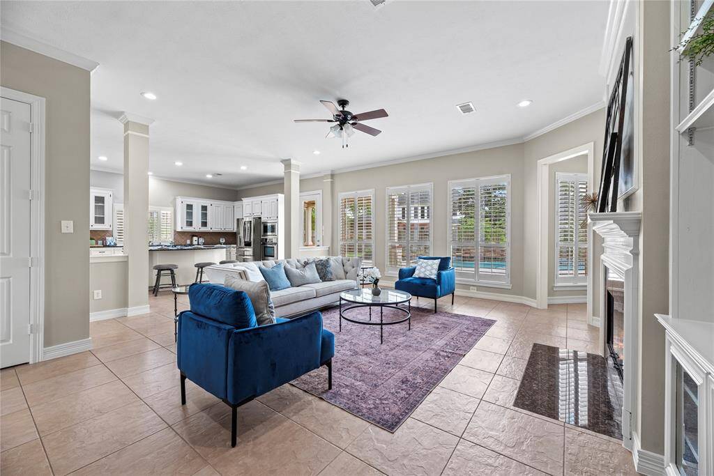 Welcoming and conveying warmth, the living room offers an inviting space for evening movies or holiday gatherings. Tune into your favorite streaming show, while admiring the cozy fireplace.