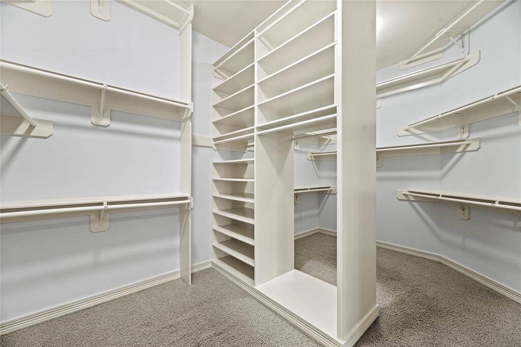 No matter how often you purchase new threads online or at the mall, this walk-in master bedroom closet has space for all your new and favorite wares!