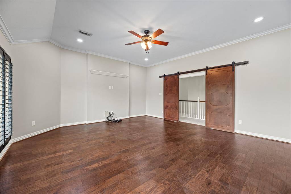High ceilings, multiple windows, and crown molding provide a sense of formality to the game and recreation room. Choose to play a family favorite such as Scrabble, or simply cozy up and read the newest fiction from your favorite author!