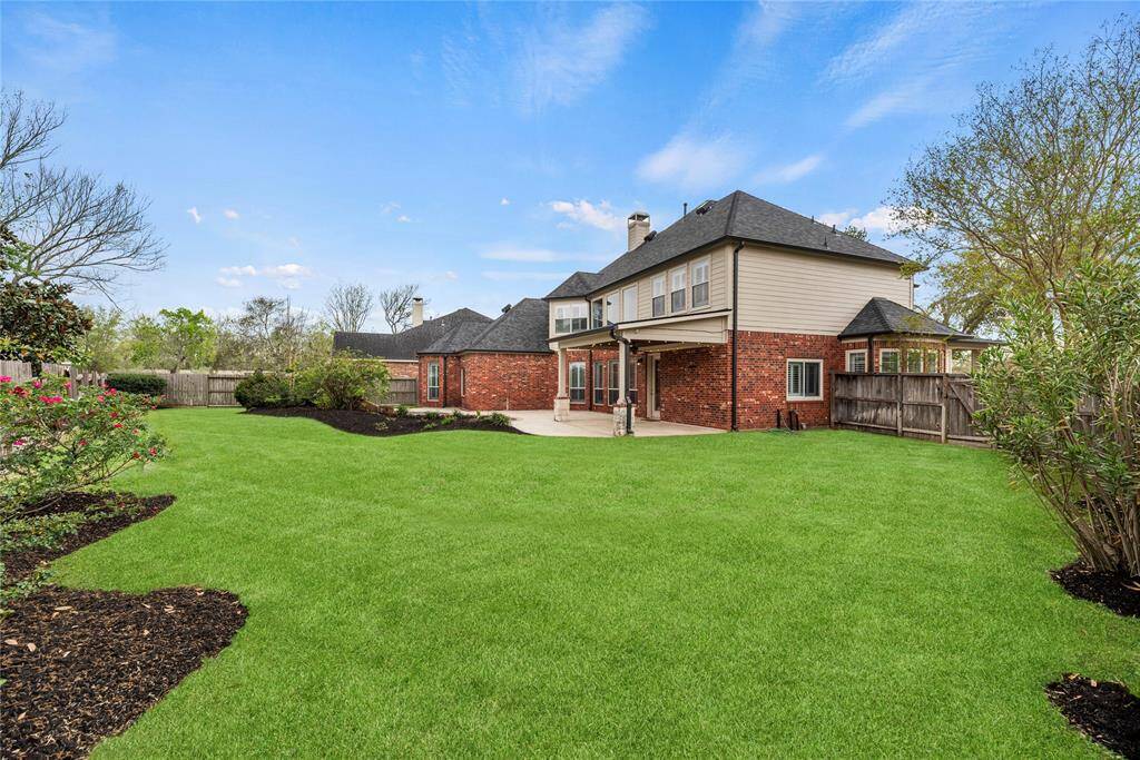 Fully fenced-in, the manicured backyard provides privacy and safety. Go for an evening swim or chat with friends over cupcakes and margaritas!