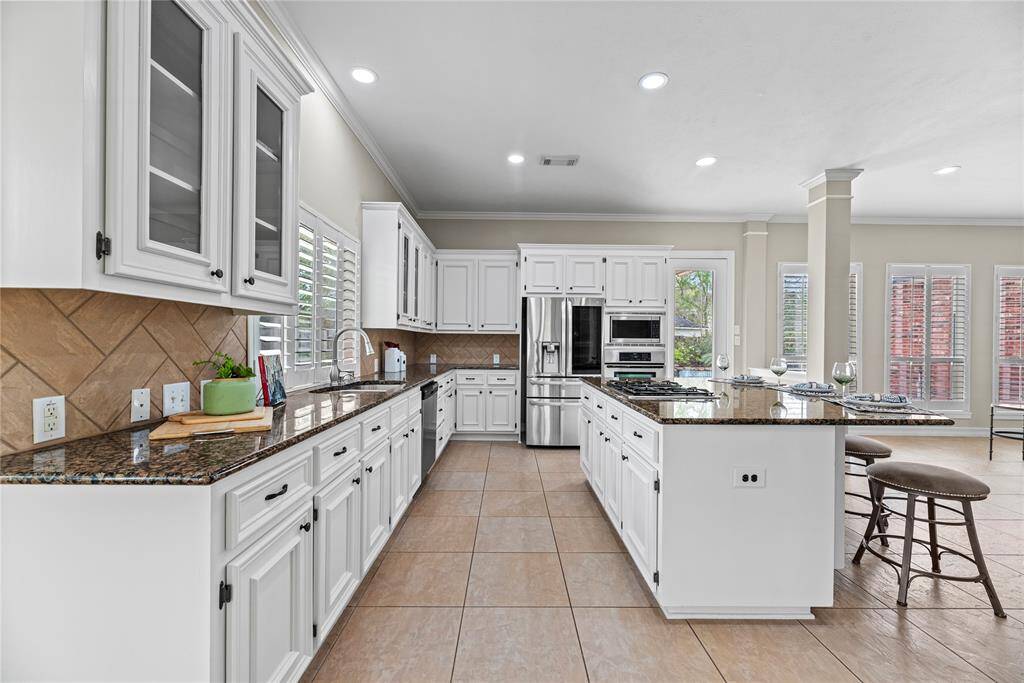 Boasting impressive storage, the center island also features an outlet for easy mixing and prepping with small kitchen appliances. Store cookie cutters and cupcake supplies beneath for impromptu baked goodies, which of course always require an urgent need!
