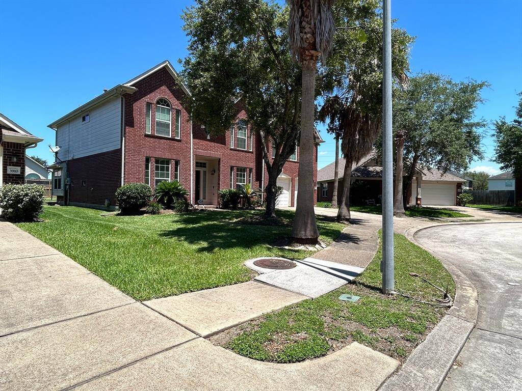 Great Two Story home with palm trees to welcome you home.