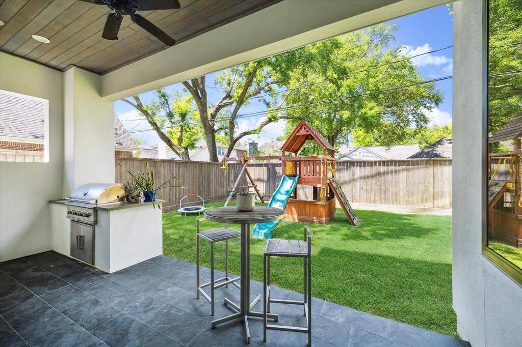 This patio offers a built-in grill and great views of the greenspace.
