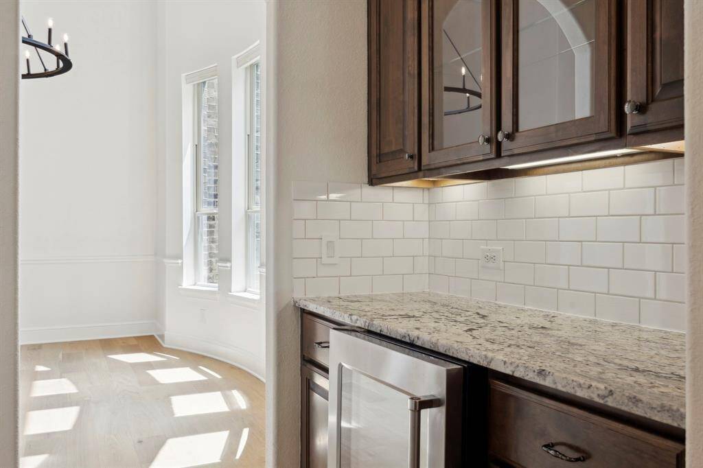 The butler pantry seamlessly connects the dining and kitchen.
