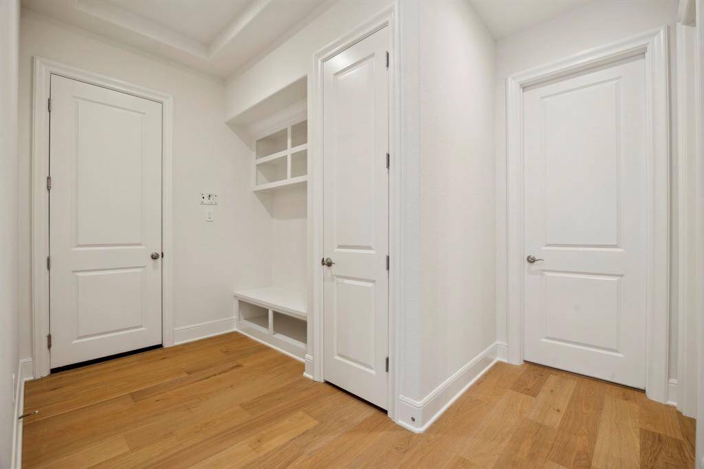 Mudroom area located off of the garage and next to the laundry room.
