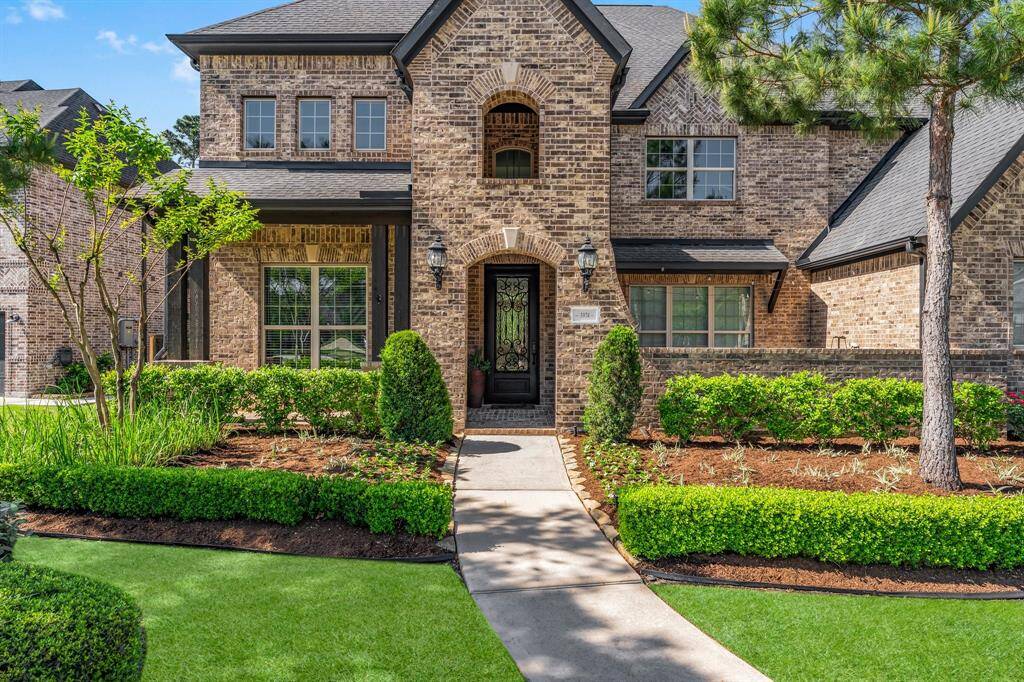 A covered porch and courtyard provide additional outdoor lounging space.
