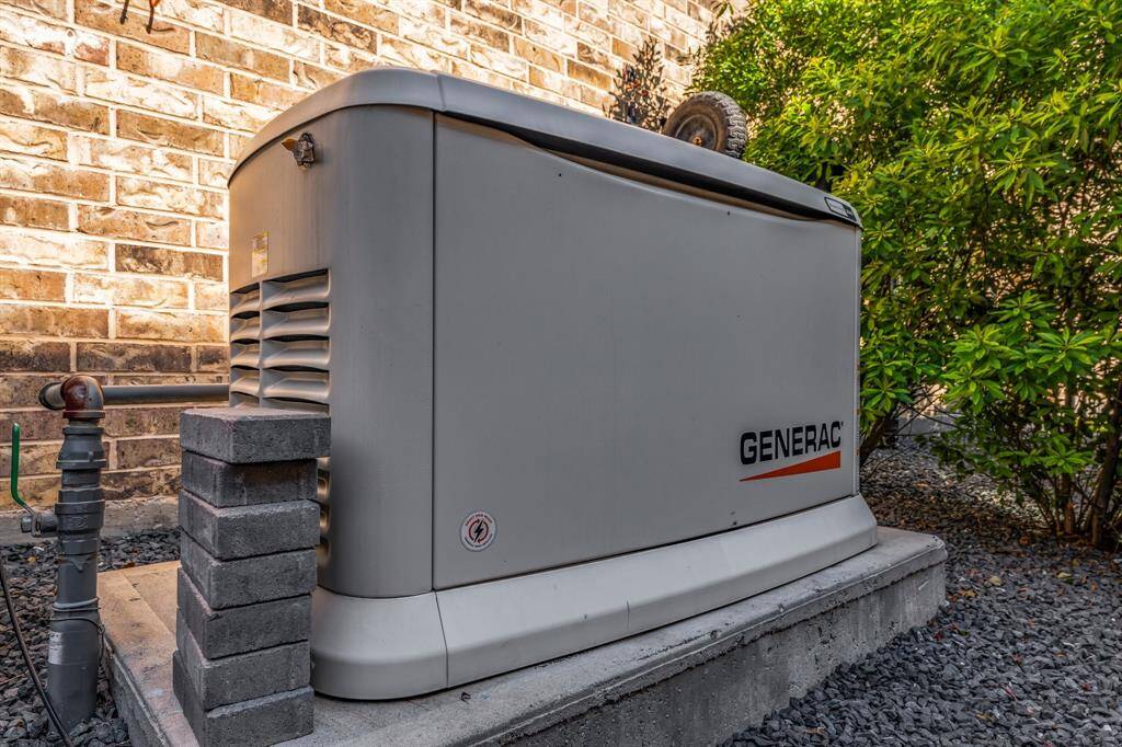 Generac generator is located next to the pool chiller!