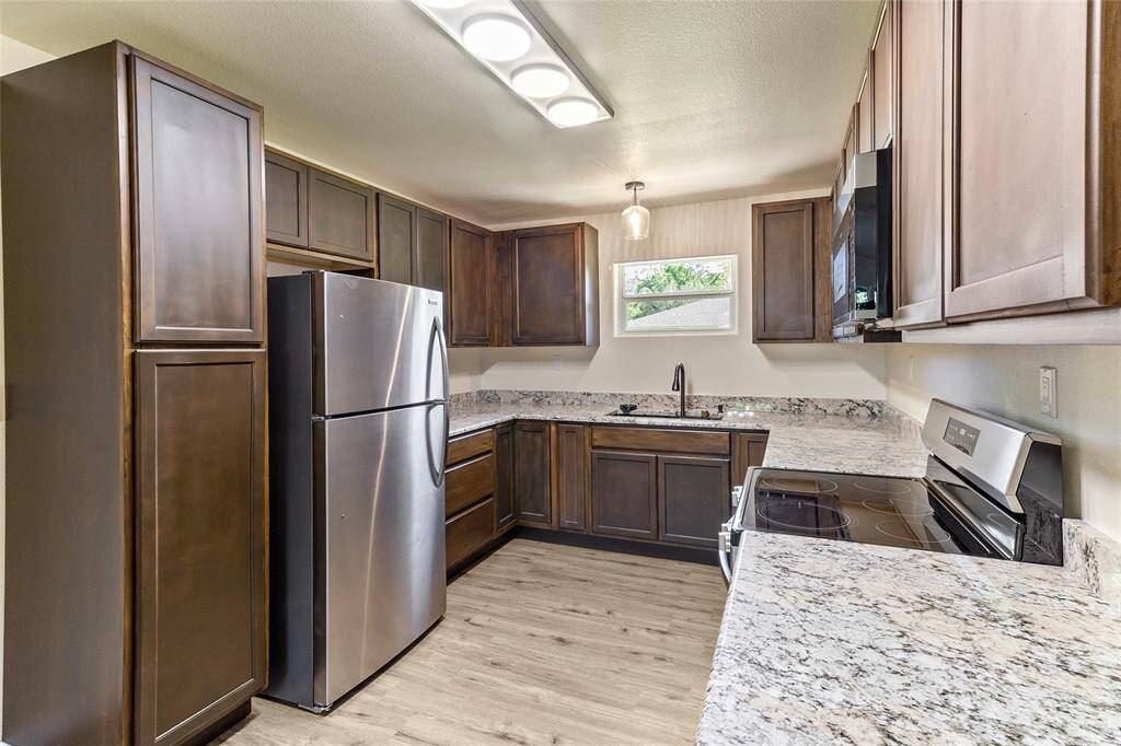 New granite countertops, stainless appliances, cabinets, and fixtures