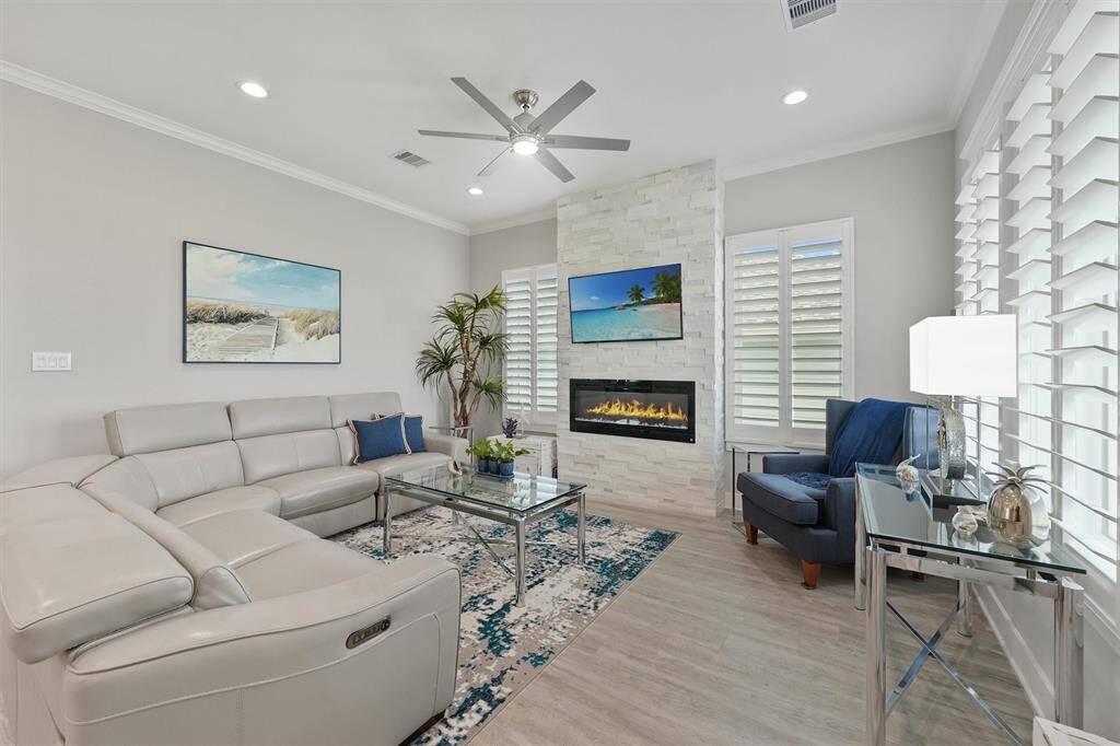 From the soft-tone luxury flooring to the sleek electric fireplace and custom window treatments, every detail is curated for relaxation.