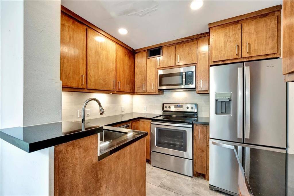 This fully functional kitchen offers lots of cabinetry