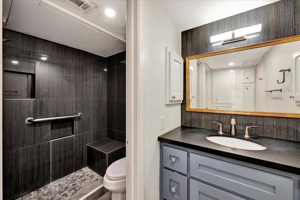 A bathroom that blends beauty and practicality with abundant storage space.