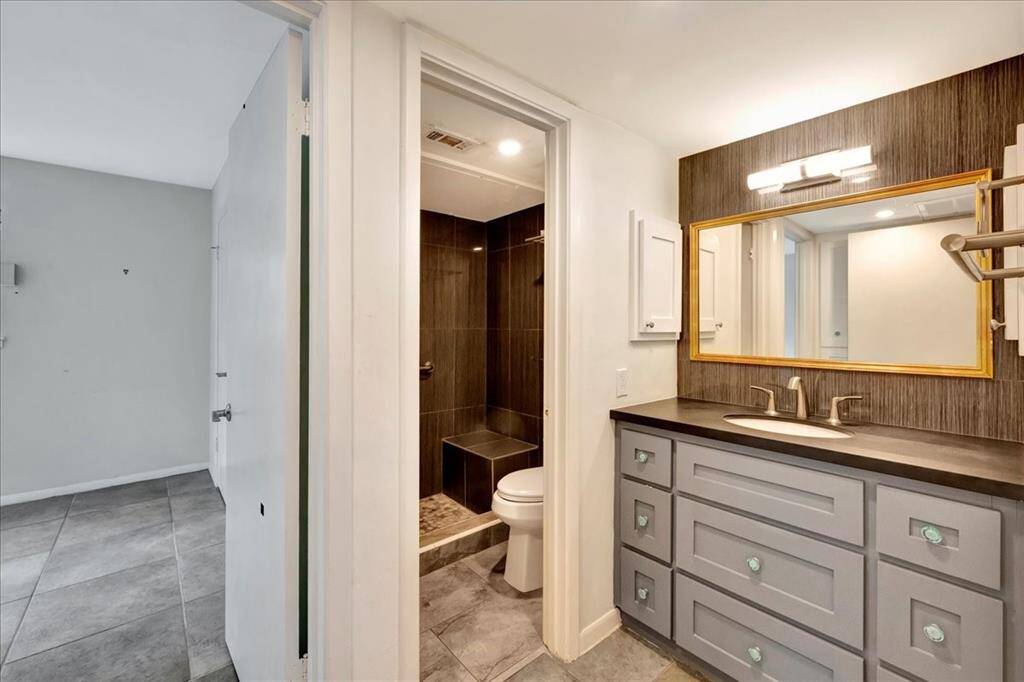 Enjoy ample room to get ready in this beautifully finished bathroom.