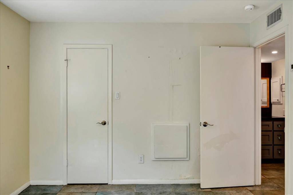 Another generously sized walk-in closet.