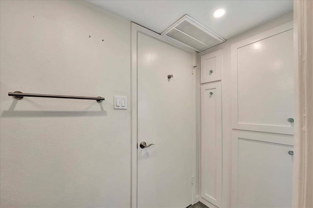 Smartly designed bathroom with generous storage throughout.