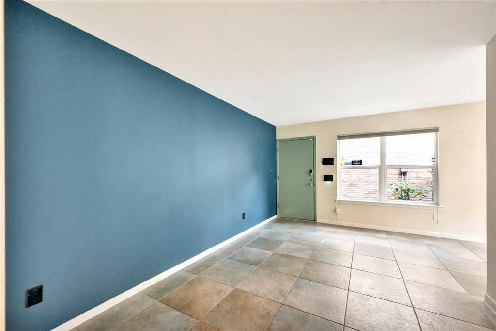 Bright & roomy living room with an open layout and ample natural light