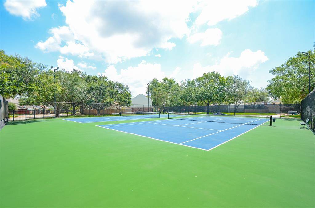 TENNIS COURTS BY THE POOL