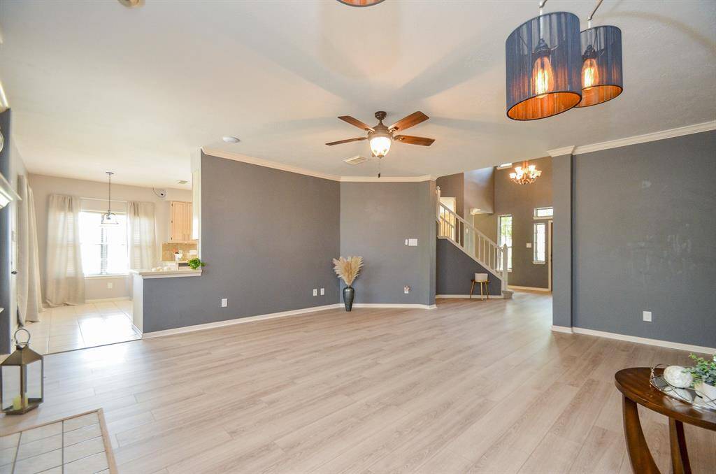 LIVING ROOM OPENS TO BREAKFAST AND KITCHEN