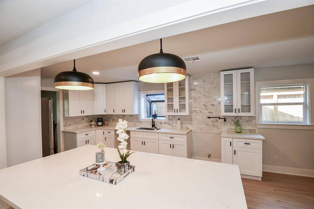 Luxury Lighting highlights Oversized Island - Picture taken before gas range installed.