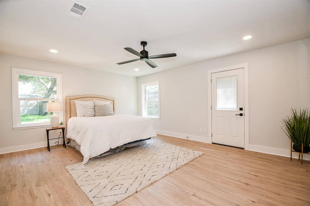 Palatial Primary Bedroom with lots of room for sitting area and Private entrance to back yard.