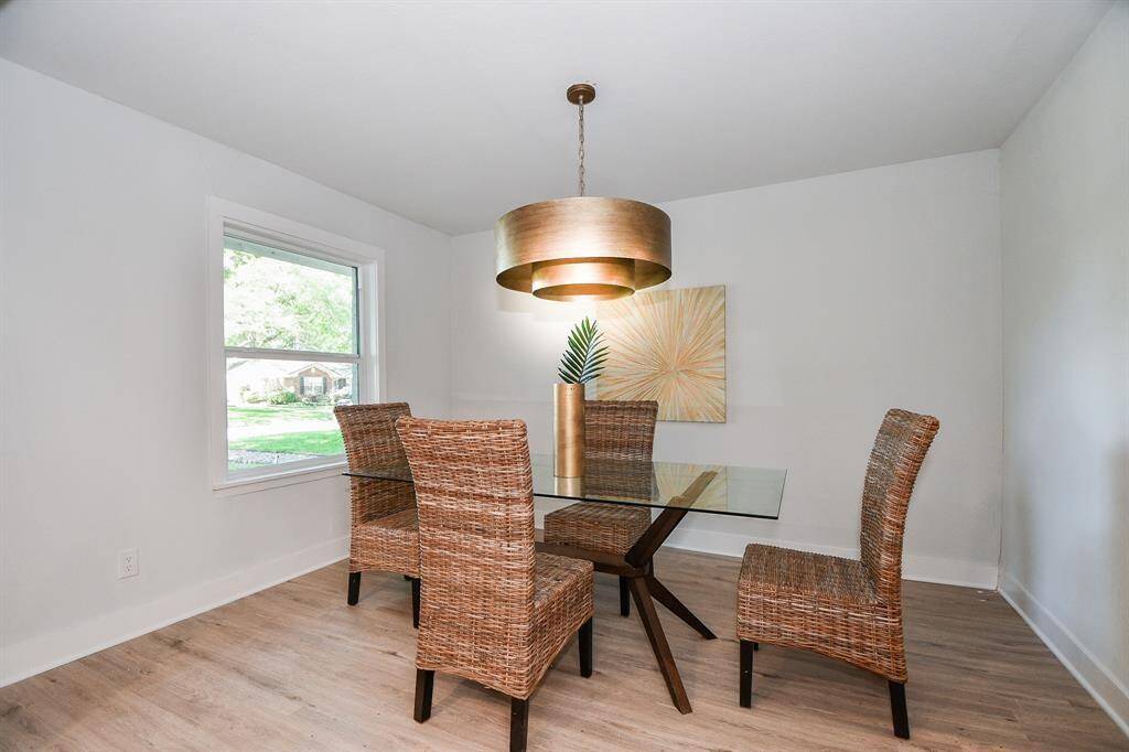 Divine Dining Room with Designer Lighting