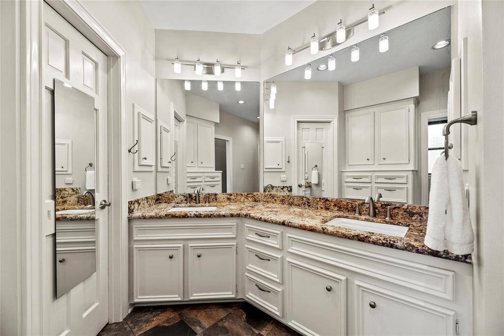 Dual sinks ensure both partners have a dedicated area for grooming and self-care! Ample counter space is only enhanced by the tremendous space beneath, which includes multiple drawers of varying sizes and base storage cabinetry!