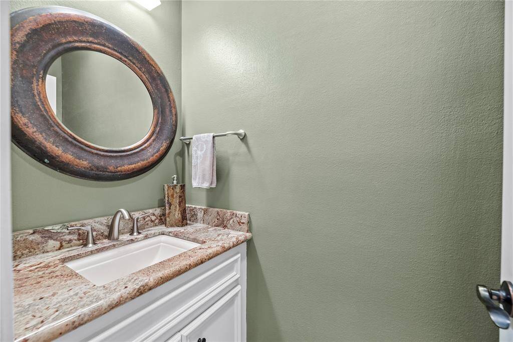 Hospitality is felt throughout the home and the powder room is no exception.