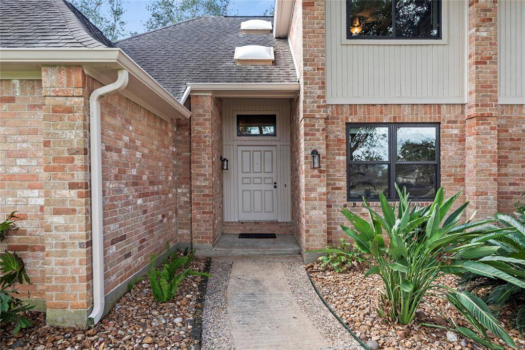 Beautifully landscaped with a mature tree, the 4BR/2.5BA, 3,290sqft home mesmerizes with a nearly, all-brick front exterior.